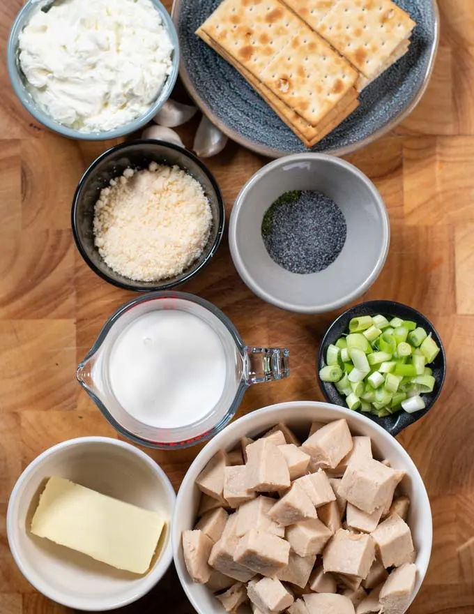 Ingredients needed to make Poppy Seed Chicken are collected on a board.