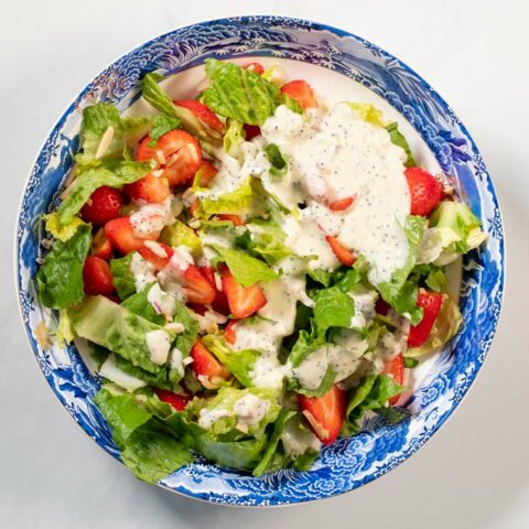 Top view of a plate with salad.