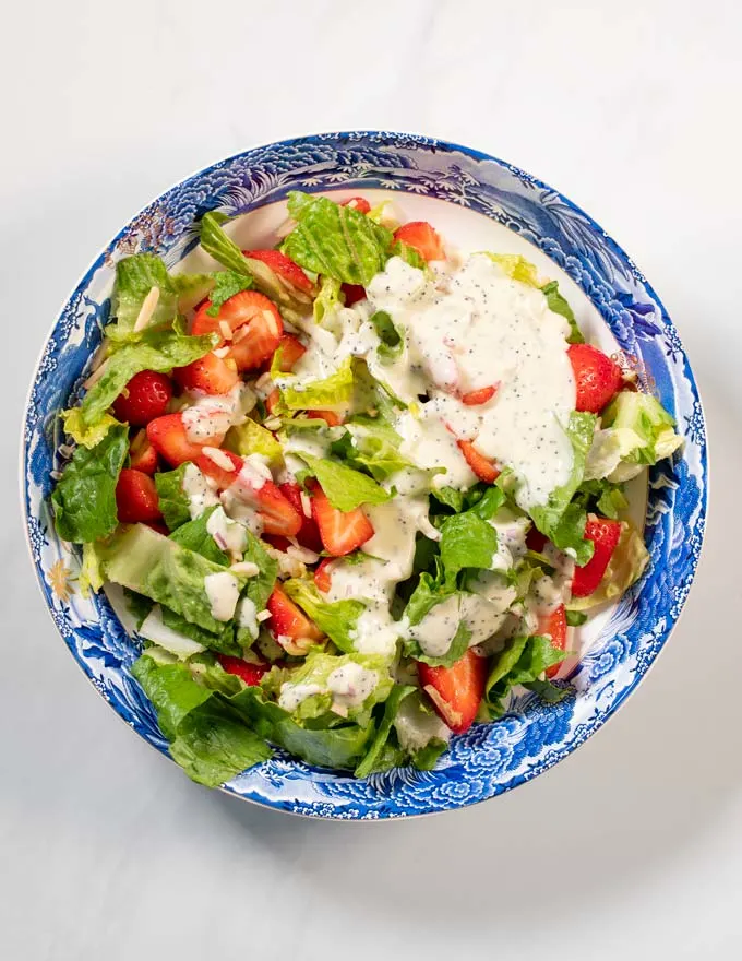 Top view of a plate with salad.