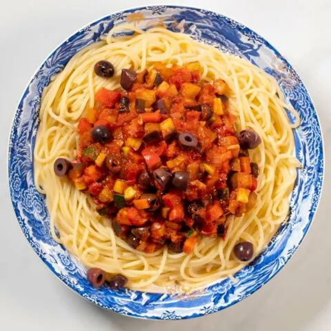 A large portion of Vegetable Spaghetti is served on a plate.