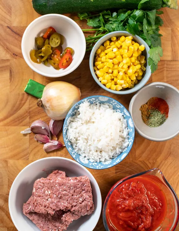 Ingredients needed to make Albondigas Soup on a board.