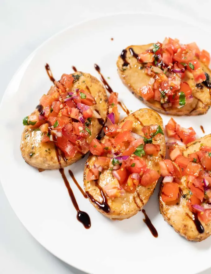 Closeup of a serving plate with Bruschetta Chicken.