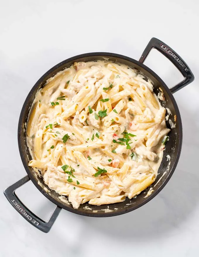 Fresh herbs are used to garnish Cajun Chicken Pasta.