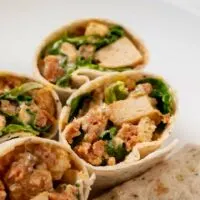 Stacks of Chicken Caesar Wraps.