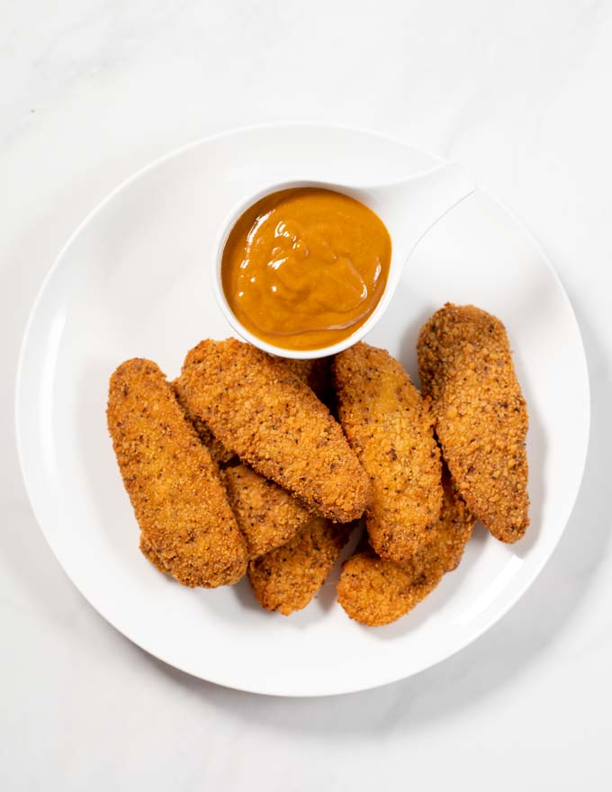 A serving of chicken tenders with Carolina BBQ Sauce.
