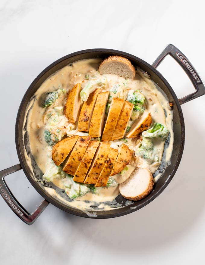 Top view of a large pan with Chicken Broccoli Alfredo.
