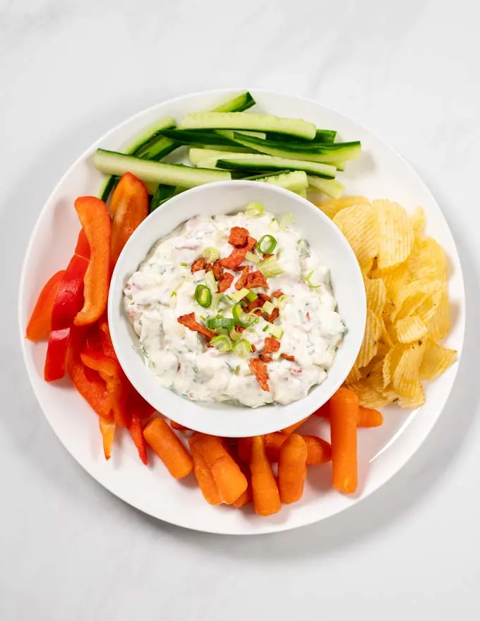 Cream Cheese Dip is served with chips and veggies.