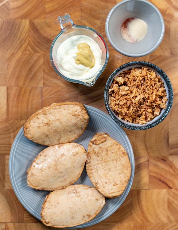 Ingredients for making Crispy Chicken collected on a board.