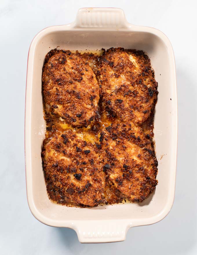 Top view of a casserole dish with the baked Crispy Chicken.