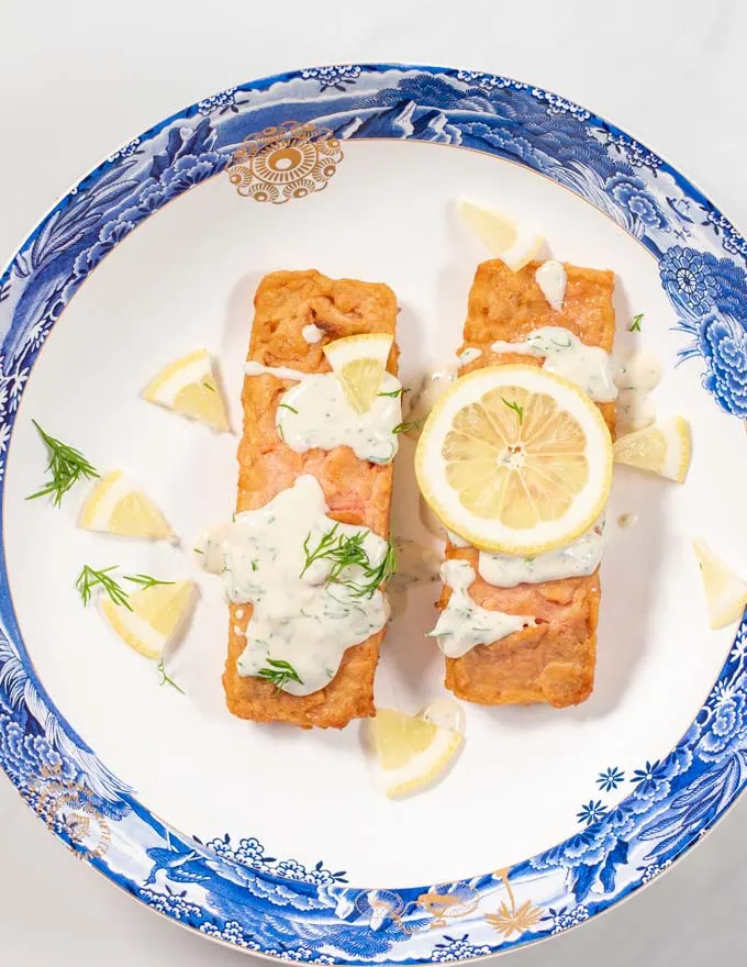 View of a serving of salmon with Dill Sauce.