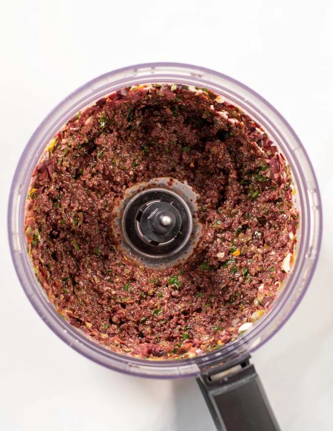 Top view of the bowl of a food processor after pulsing.