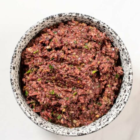 A serving bowl with Olive Tapenade.