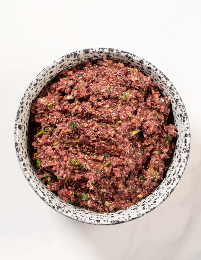 A serving bowl with Olive Tapenade.