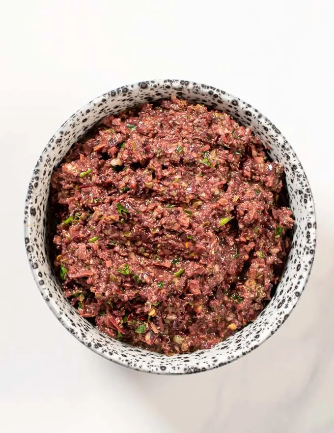 A serving bowl with Olive Tapenade.