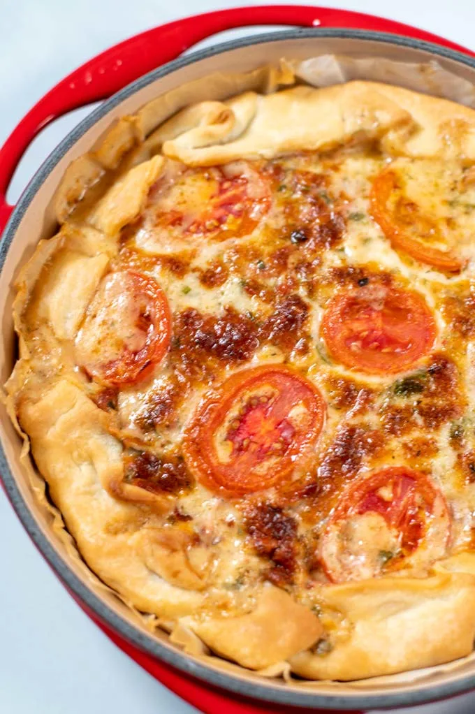 Closeup view of the baked Tomato Pie as it comes out of the oven.