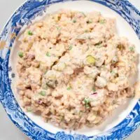 Top view of a large serving bowl with Tuna Macaroni Salad.