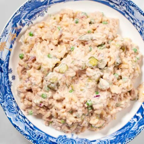 Top view of a large serving bowl with Tuna Macaroni Salad.