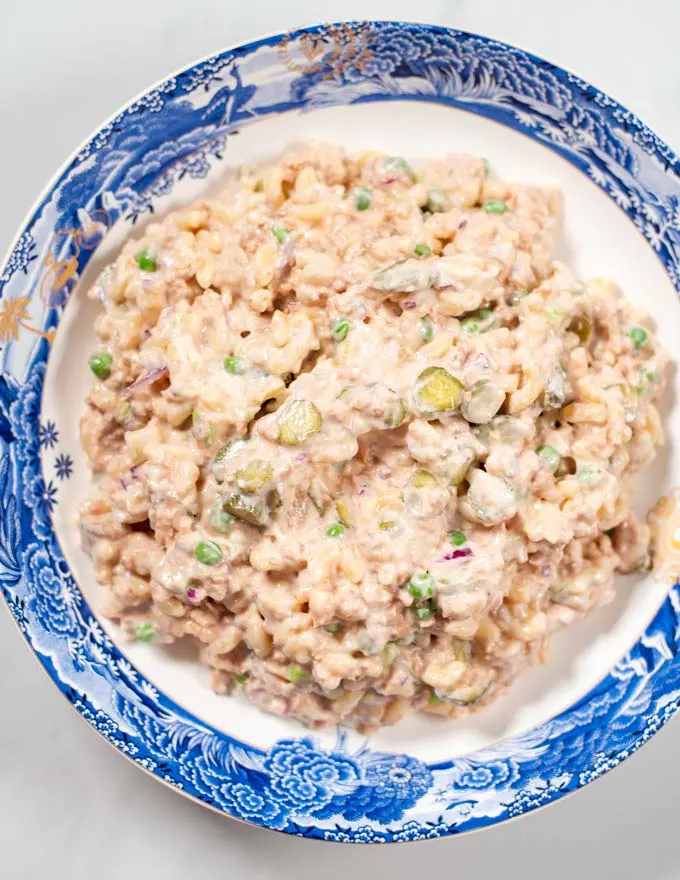 Top view of a large serving bowl with Tuna Macaroni Salad.