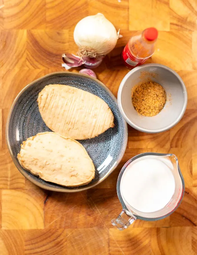 Collection of ingredients needed to make Cajun Chicken.