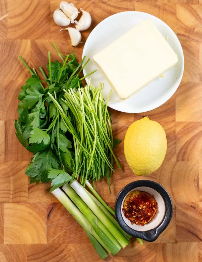 Ingredients needed to make Cowboy Butter on a board.