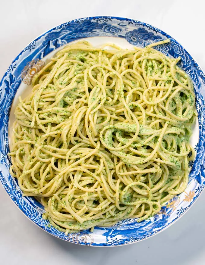 Serving of Green Spaghetti on a plate.
