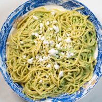 Queso fresco is used as garnish for Green Spaghetti.