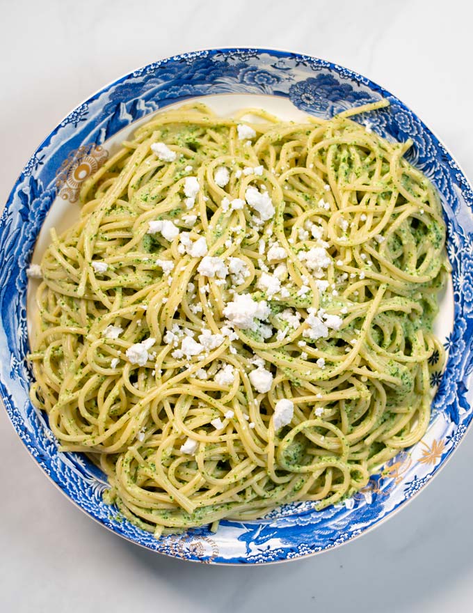 Queso fresco is used as garnish for Green Spaghetti.