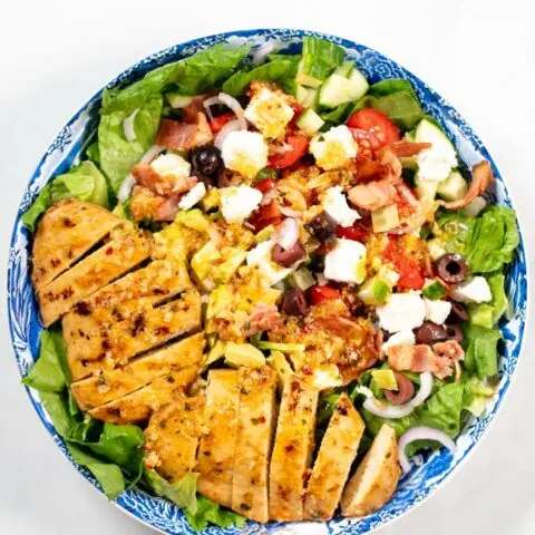 Top view of a large serving plate with Grilled Chicken Salad.