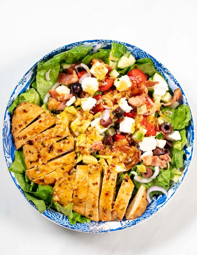 Top view of a large serving plate with Grilled Chicken Salad.