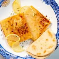 Serving of Saganaki with pita bread.