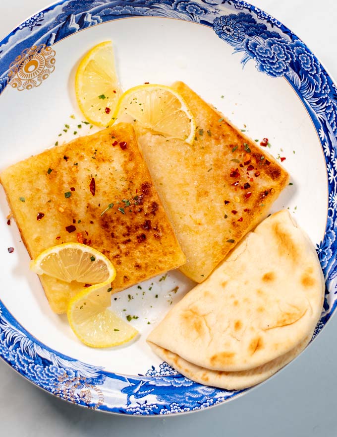 Serving of Saganaki with pita bread.