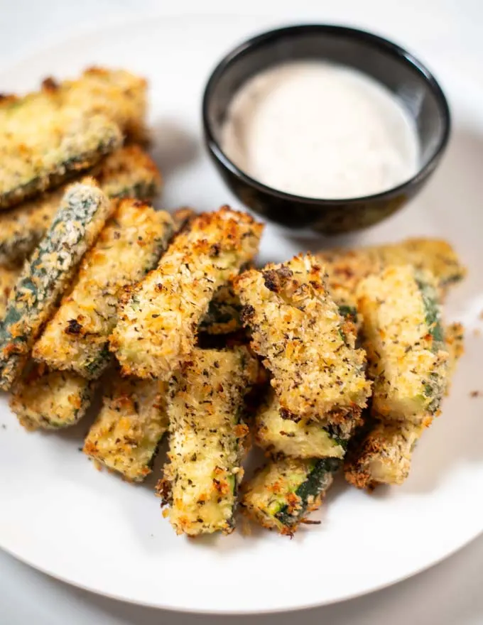Closeup of Zucchini Fries on a white plate.