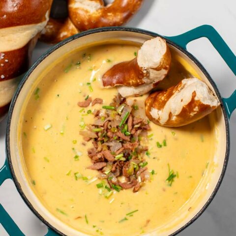 Soft pretzels are dipped into Beer Cheese Soup.