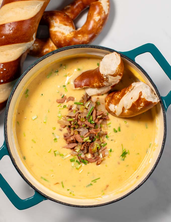 Soft pretzels are dipped into Beer Cheese Soup.