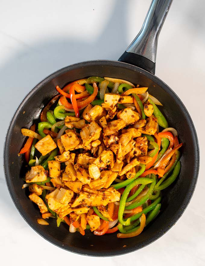 Top view of a frying pan with the Chicken Fajitas.