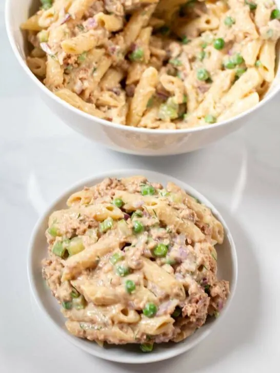 Serving of Tuna Pasta Salad with serving bowl in the background.
