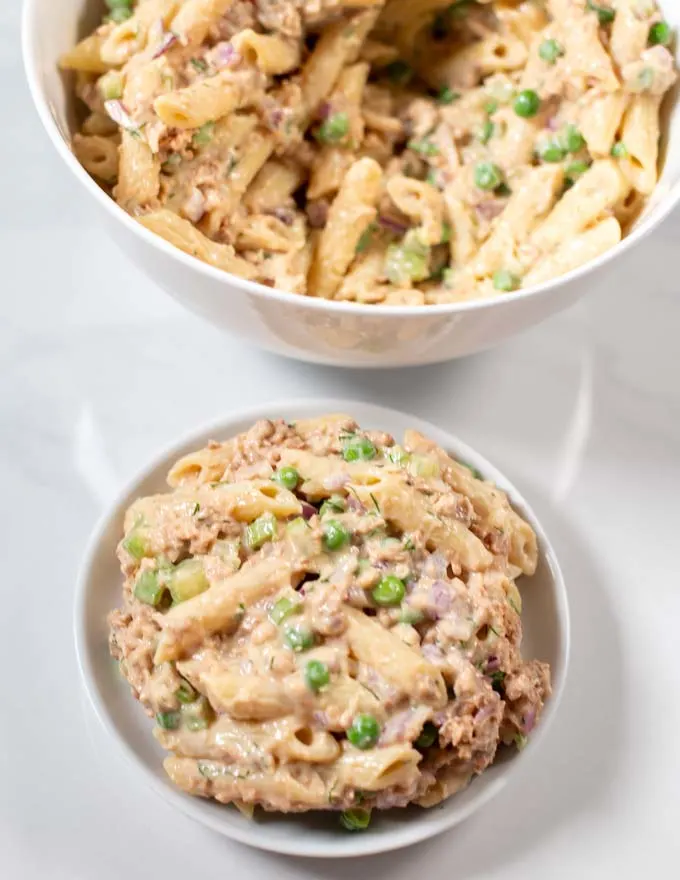 Serving of Tuna Pasta Salad with serving bowl in the background.