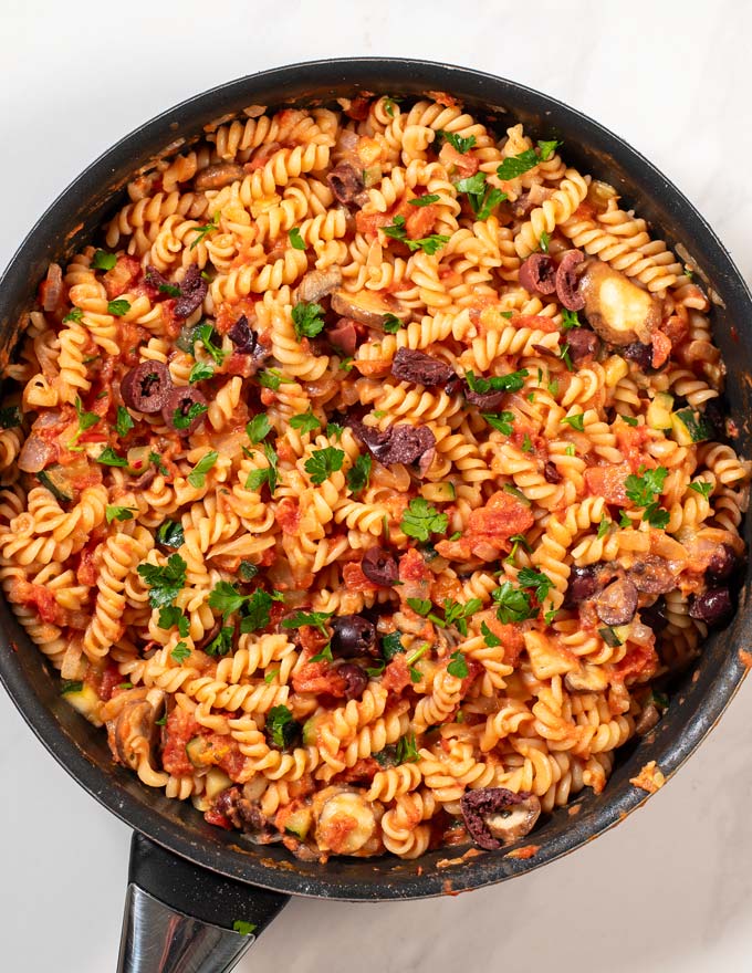 Top view of a pan with Veggie Pasta, garnished with parsley.