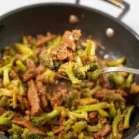 Closeup on a spoon full of Beef Broccoli.