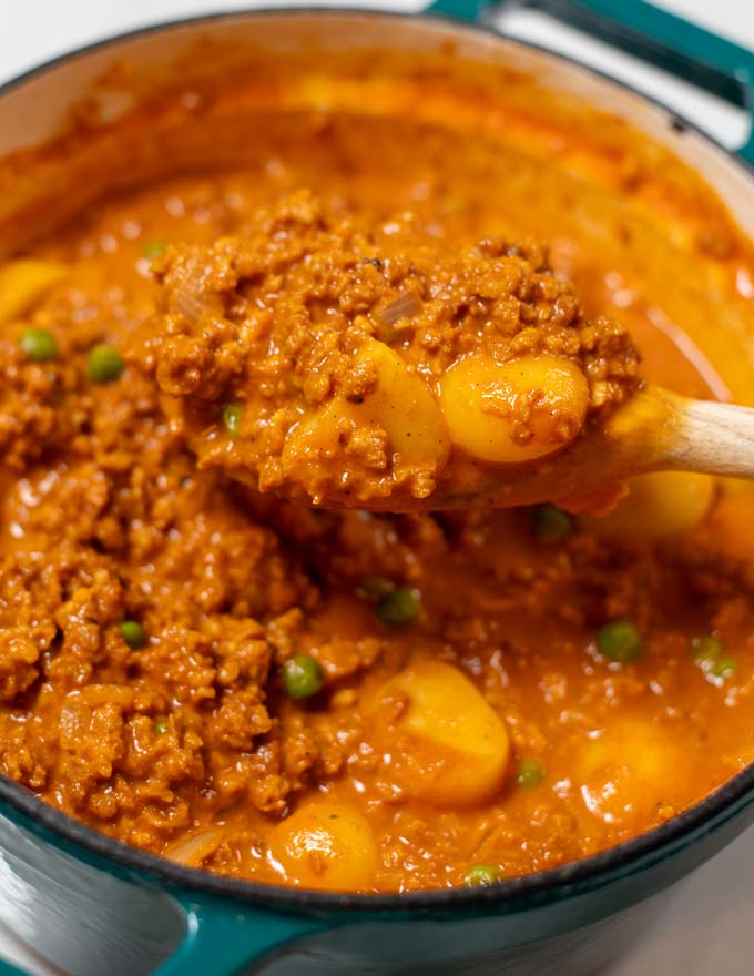 A closeup of a large spoon full of Hawaiian Hamburger Curry.