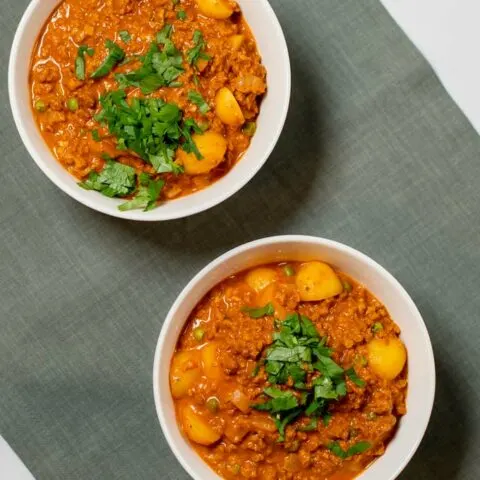 Two servings of Hamburger Curry in white bowls.