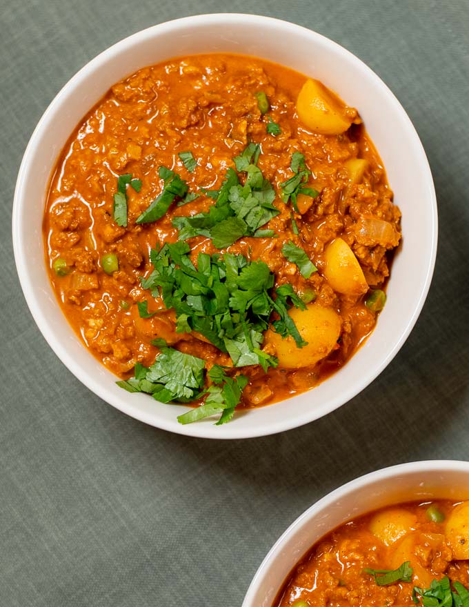 Closeup on a bowl with Hawaiian hamburger Curry, garnished with fresh cilantro.