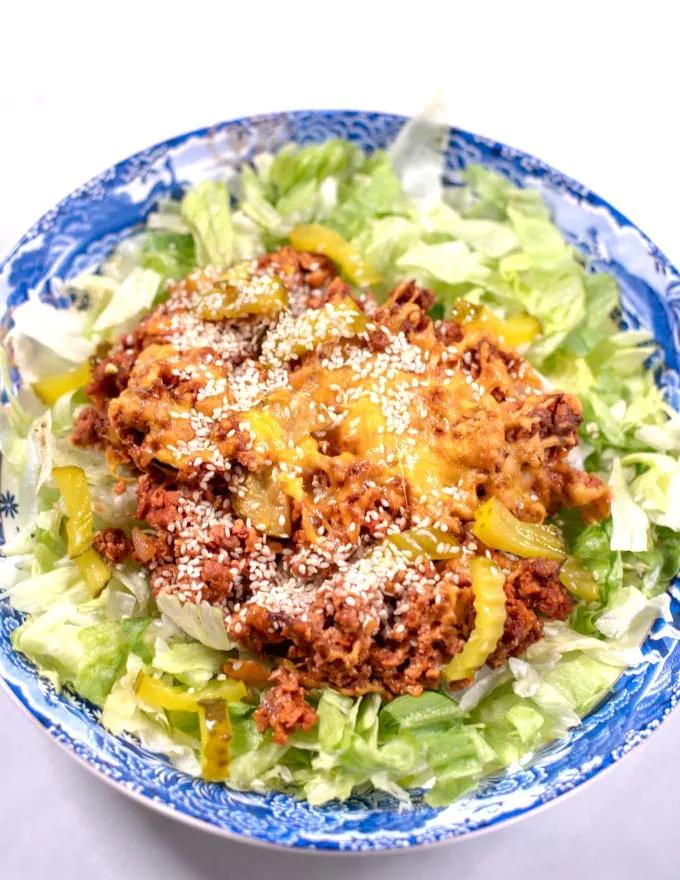 A serving of Keto Big Mac Casserole is garnished with sesame seeds.