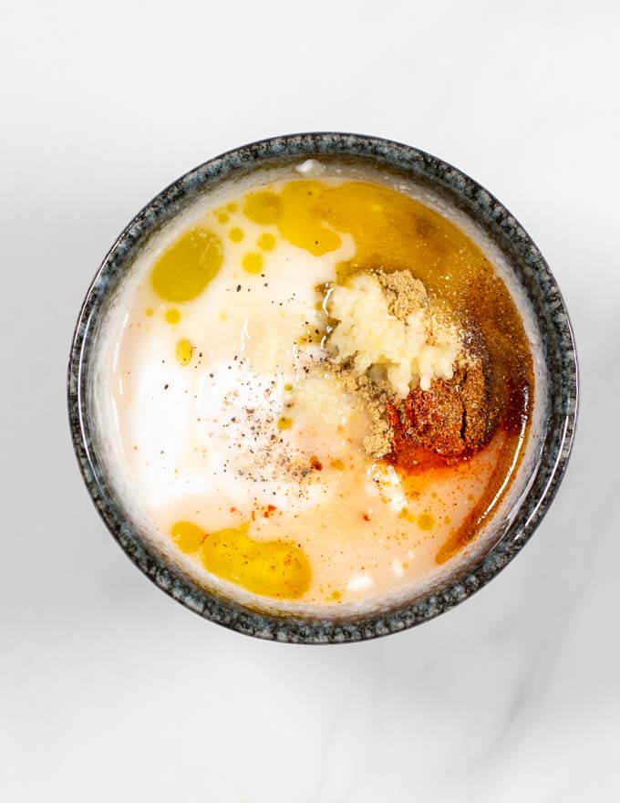 Top view of a small mixing bowl with all ingredients of the Southwestern Salad Dressing.