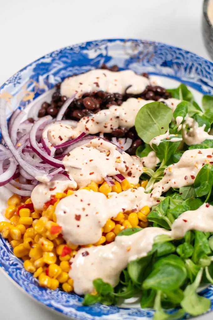 Closeup on the Southwestern Salad Dressing on a served salad.