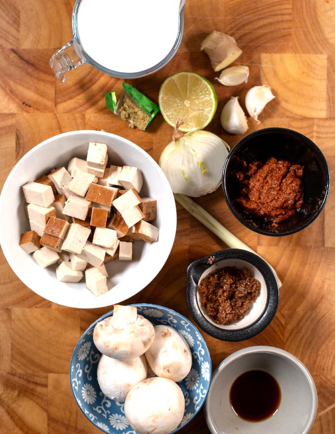 Ingredients needed to make Tom Yum Soup are collected on a board.