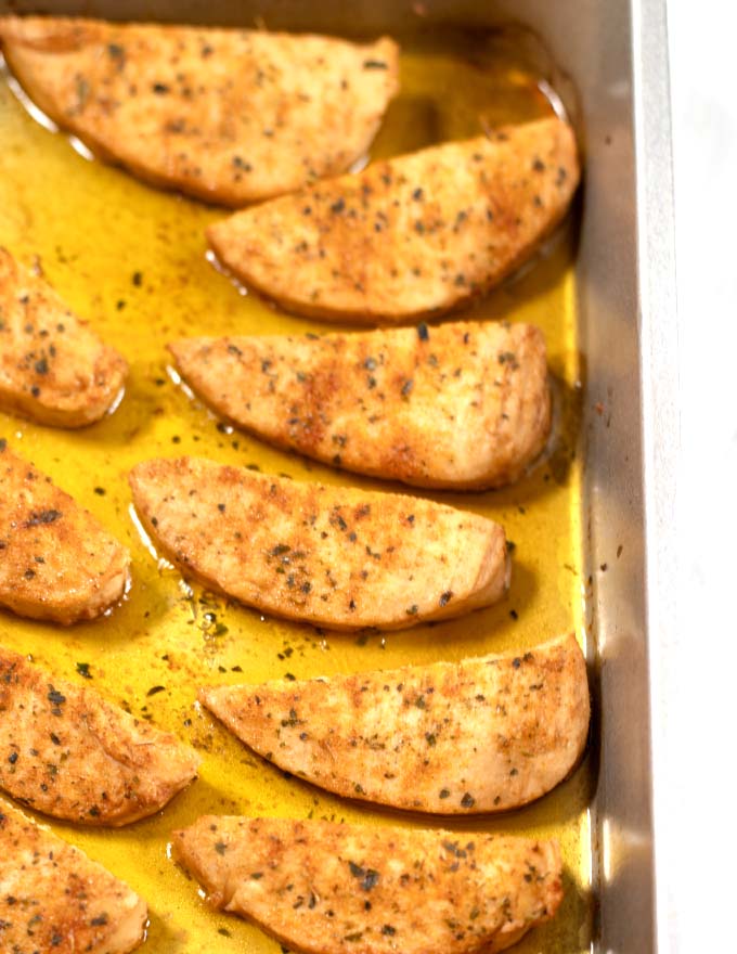 Baked Chicken Tenders in a casserole dish.