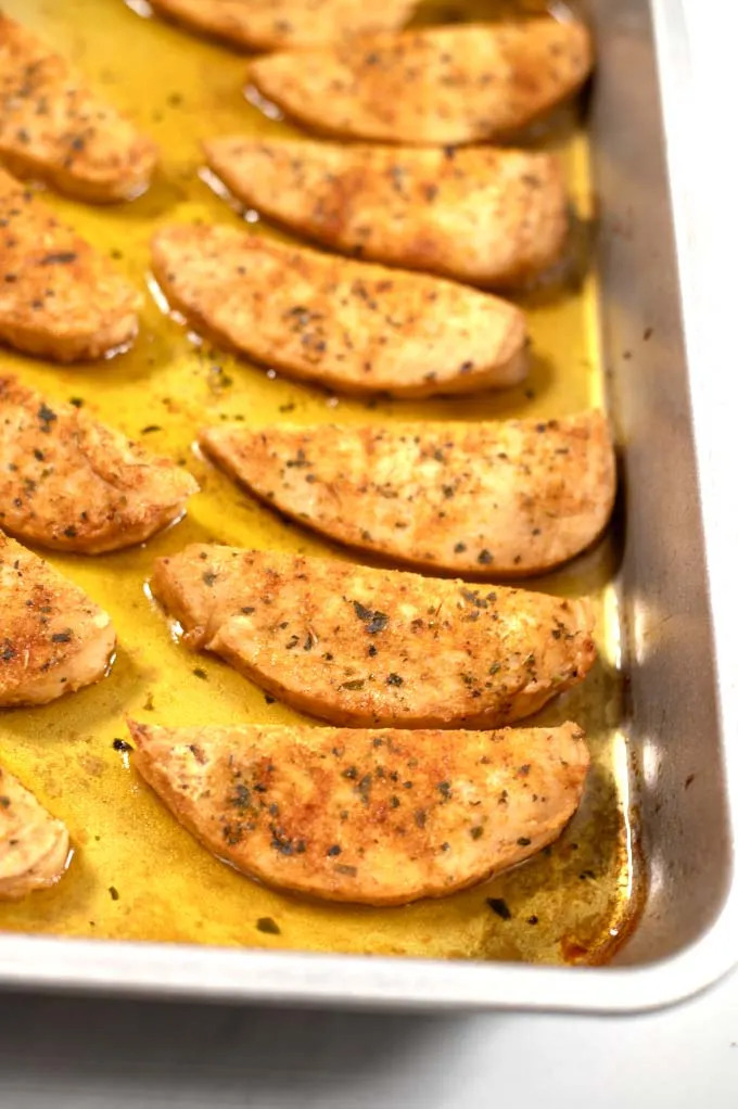 View of a casserole dish with the finished chicken fingers.