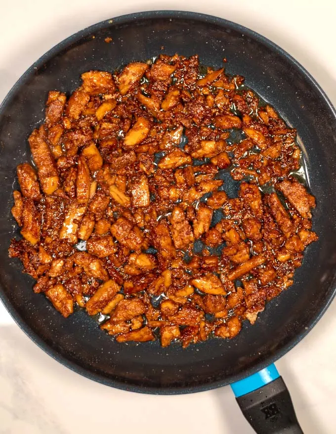 Top view of Cajun Sticky Chicken in a large skillet.