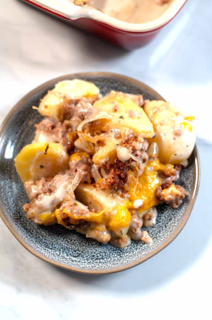 Closeup on a single serving portion of Hamburger Potato Casserole. 